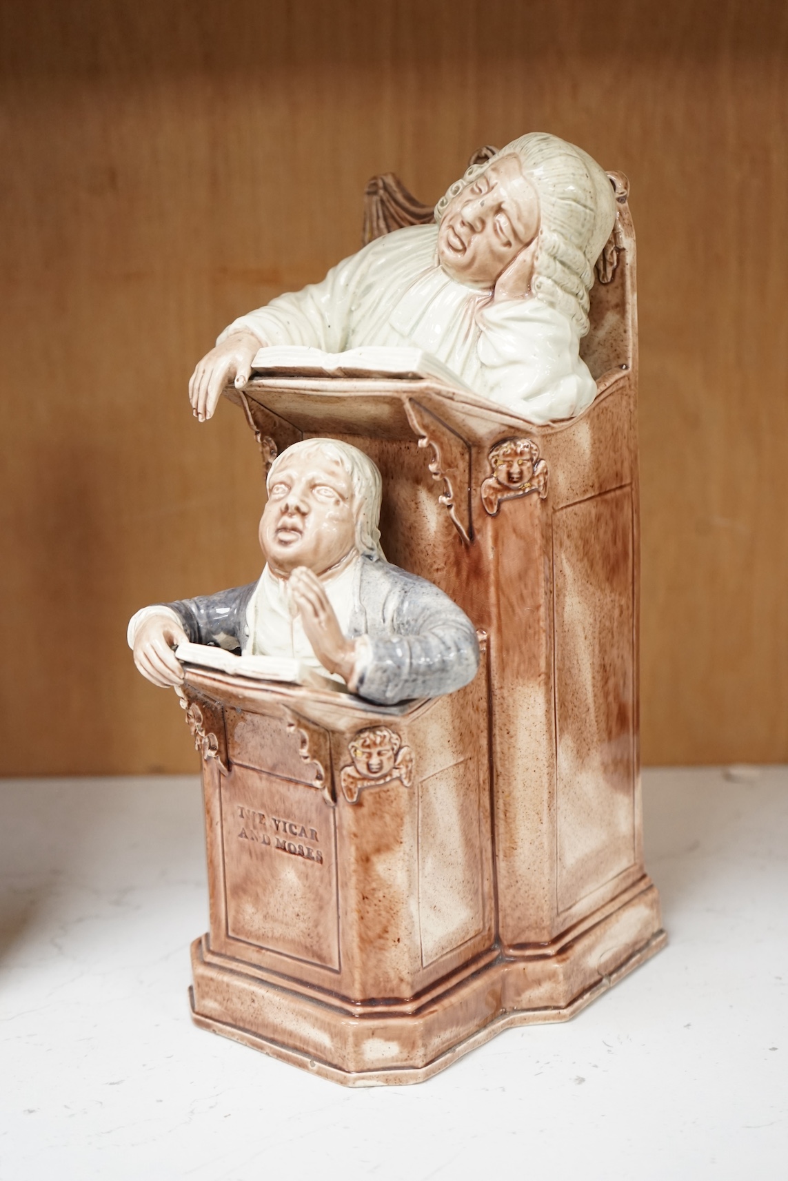 A late 18th century Ralph Wood type creamware Vicar and Moses group, 24cm high. Condition - restored